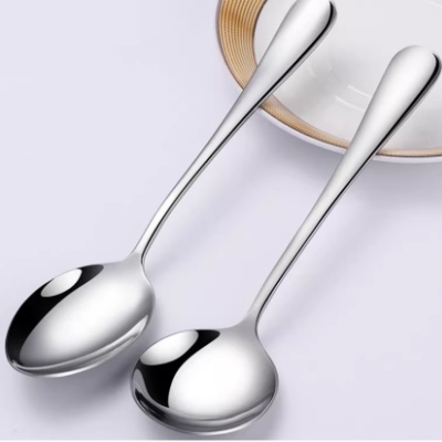 Polishing and cleaning the inner curve of a stainless steel spoon