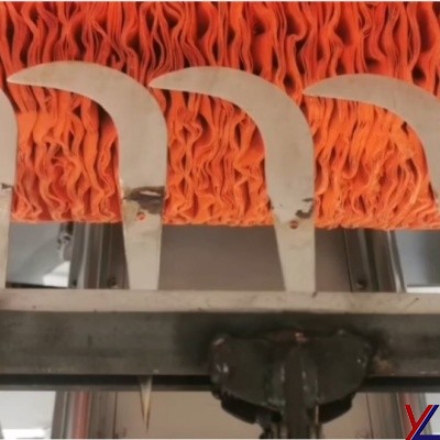 Automatic double-sided polishing machine for cutting tools.